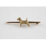 A 9ct. gold 'Terrier dog' bar brooch, with chased and engraved fur detail, impressed "9ct", width