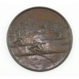 Rowing Interest; a European bronzed metal circular plaquette, signed "Carlier", oarsmen skull to