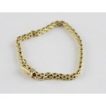 An 18ct, yellow gold panther chain bracelet, width 4.5mm, length 18cm, clasp impressed "750". (17.