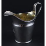 A George III neo-classical silver jug, by William Frisbee, assayed London 1794, having undulating