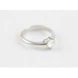 An 18ct. white gold and heart shaped diamond ring, having three claw set heart shape cut diamond (