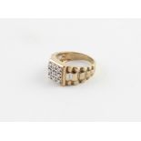 A 9ct. two-tone gold and diamond "Rolex" style gentleman's ring, the square face set nine round