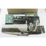 A large quantity of postcards, to include; an album containing various 1950's American postcards