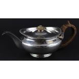 A George III silver teapot, by Alice & George Burrows II, assayed London 1816, of circular form,