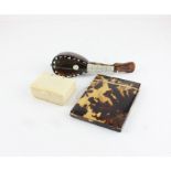 An ivory pill box, tortoiseshell mandarin and tortoiseshell card case