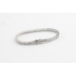 An 18ct. white gold and diamond tennis style bracelet, the links and clasp box set sixty-five