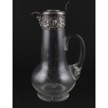 A continental silver mounted glass claret jug, early 20th century, of circular baluster form with