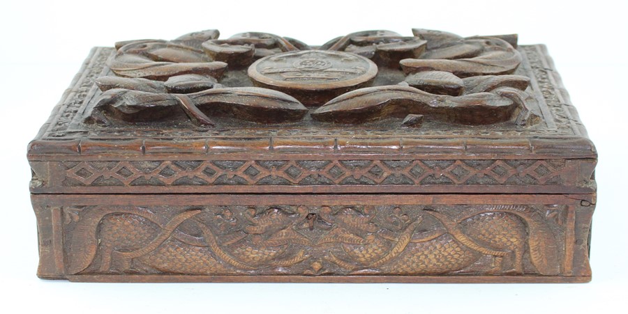 Military interest, An Indian carved hardwood table top box, possibly for cigarettes, the top