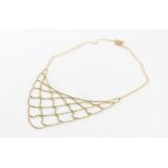 A 9ct. yellow gold fringe type choker/princess necklace, formed from faceted spherical beads, having