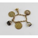 A yellow metal charm bracelet, formed from faceted ovoid links (yellow metal assessed as 18 carat