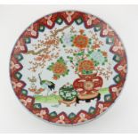 A Japanese Meiji period porcelain charger, decorated with blossom and Crane, diameter 37.1cm.