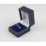 An 18ct. yellow gold, sapphire and diamond ring, the white gold mount claw set four marquise shape