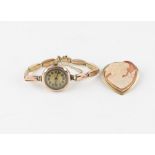 A 9ct. rose gold ladies' bracelet watch, manual movement, having Arabic numeral dial with outer