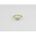 An 18ct. gold and solitaire diamond ring, claw set round old brilliant cut (diamond weight approx.