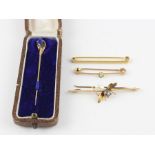 A 9ct. yellow gold, light blue stone and mother of pearl "bee" bar brooch, having engraved wing