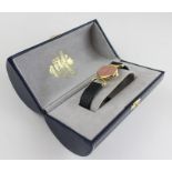 An 18ct. yellow gold Baume & Mercier ladies' wrist watch, manual wind, having signed pink oval