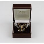 A 9ct yellow and white gold, sapphire and diamond butterfly brooch, the openwork butterfly having
