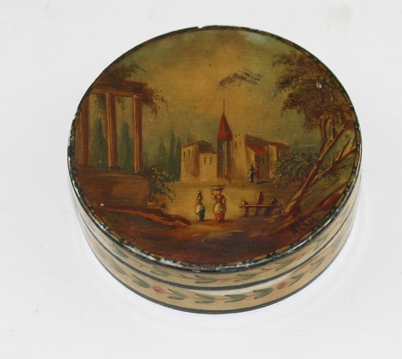 A 19th century Ivory Indian circular box and cover, the lid painted with a European landscape with