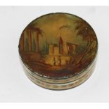 A 19th century Ivory Indian circular box and cover, the lid painted with a European landscape with