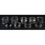 A harlequin set of nine silver circular napkin rings, (total silver weight 136.3g). (9)