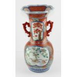 A late 19th century Japanese Meiji Period Imari twin handled vase decorated in typical palette with