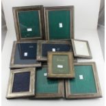 A collection of nine silver photograph frames, all of rectangular form with easel backs for portrait