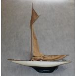 An Edwardian model pond yacht with original masts, at fault , whole length: 92cm