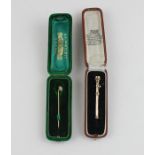 A 9ct. gold retractable tooth pick, the hexagonal holder with engraved decoration and sliding collar