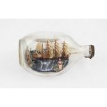 A Haig's Whisky ship in a bottle, in original dimple glass, 20 cm long, together with A WW2