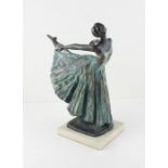 A collection of resin ballerinas figures
