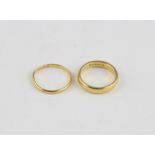 Two 22ct. yellow gold bands, both plain polished and hallmarked for 22 carat gold. (total weight 7.
