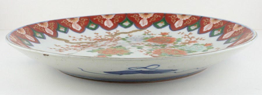 A Japanese Meiji period porcelain charger, decorated with blossom and Crane, diameter 37.1cm. - Image 2 of 4