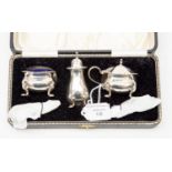 A five piece silver cruet set, including spoons, both salt spoons, one silver one plated 3.