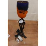 French signed Art Nouveau small table lamp with orange and purple glass shade and wrought iron