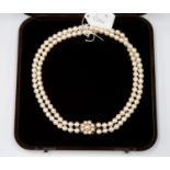 A cultured pearl two row with 9 ct gold cultured pearl cluster clasp,