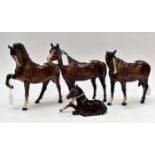 Three Beswick horses and a foal