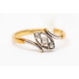 An Art Deco diamond cross over ring, set in platinum and 18ct gold, size Q,