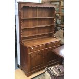 A 20th century oak dresser and rack