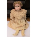 KAMMER REINHARDT: A reproduction bisque head Kammer Reinhardt girl doll, open eyes, closed mouth,
