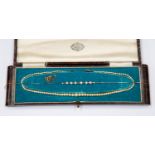 A 1930's cultured pearl necklace and box,