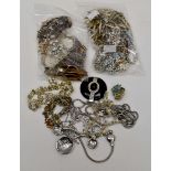 Costume jewellery in three bags,