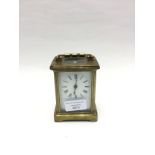 A 19th Century brass cased carriage clock, with a white enamelled,
