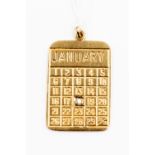 A 9ct gold pendant in the form of a January calendar, set with a brilliant cut diamond,