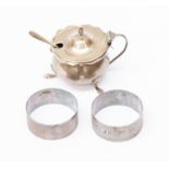Two silver Birmingham 1920 napkin rings, cauldron style silver mustard pot,