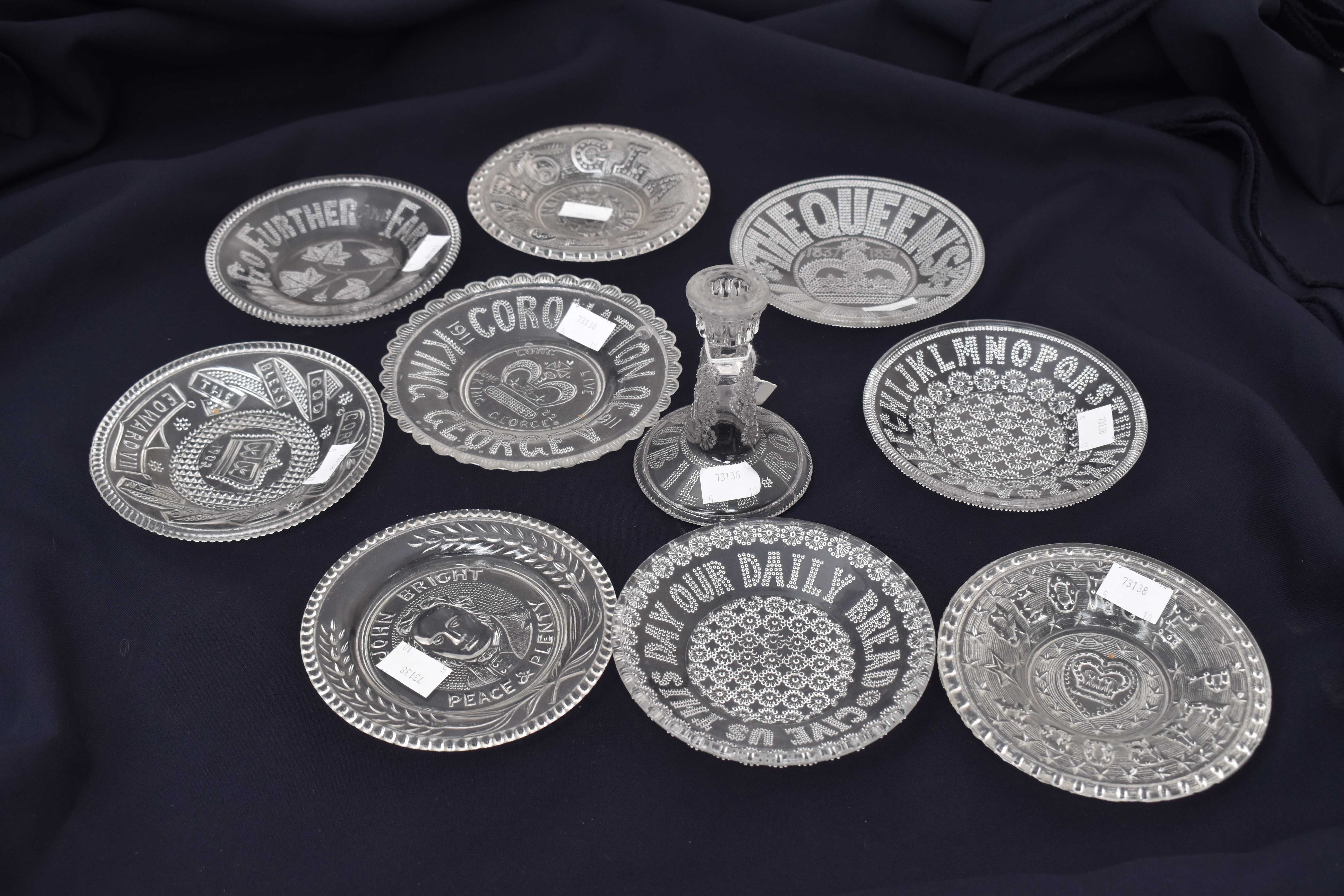 A collection of nine miniature late Victorian and later commemorative pressed glass dishes,