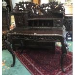 A hardwood oriental style ladies writing desk, ornately carved.