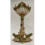 Continental porcelain table centre piece with cherub and floral decoration A/F