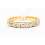 A diamond ring, comprising three rows pf pave set brilliant cut diamonds to the top,