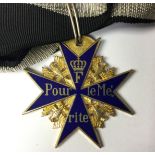 Reproduction WW1 Imperial German Pour Le Merite "Blue Max". With a short section of ribbon.
