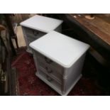 A pair of Laura Ashley white three drawer bedside chests,